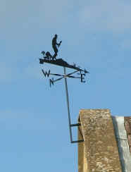 The weather vane on the school